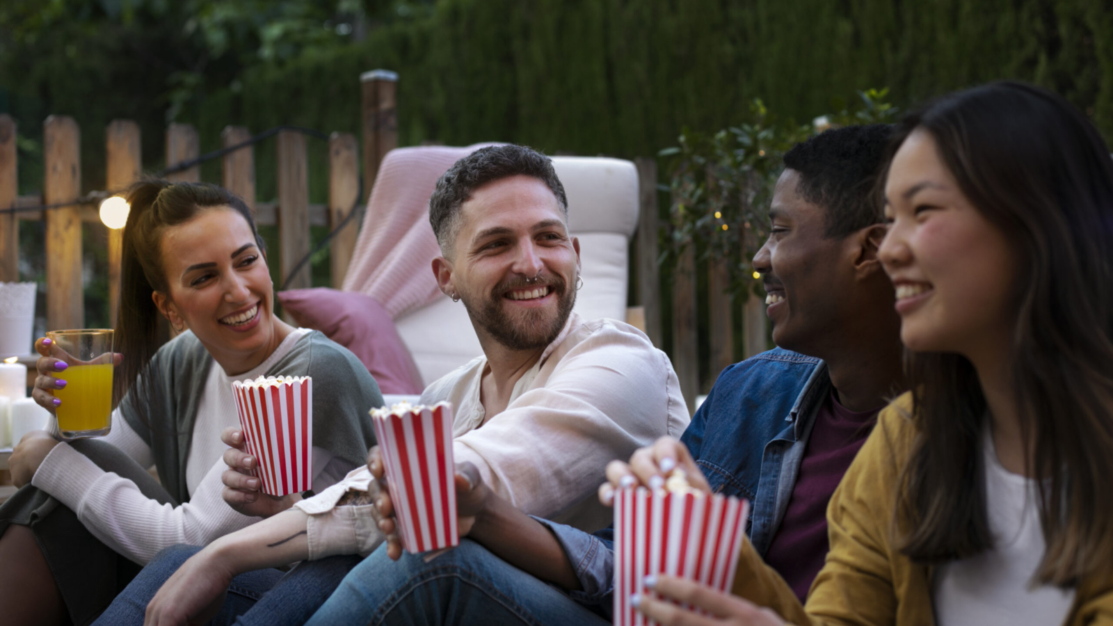 young-friends-having-fun-cinema-open-air